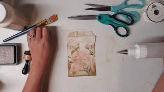 Decoupage a glassine bag with a napkin.