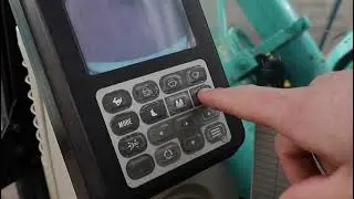 Selecting different working modes in Kobelco Excavator