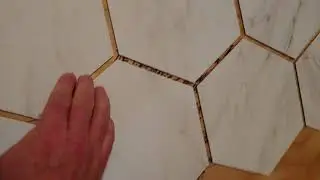 Peel and stick tile coming up fix - use heat!
