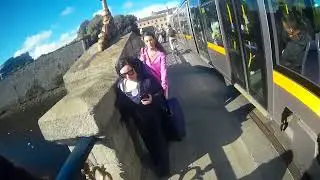 Blind pedestrian walking from Heuston Luas stop across S&eacute;an Heuston Bridge to Parkgate Street.