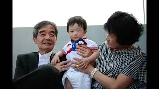 Korean baby with grandparents on his 1st birthday
