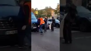 Police HELP eco protester sit in front of van blocking traffic
