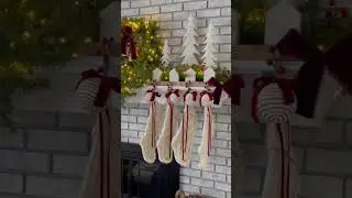 Cozy fireplace holiday decor featuring King of Christmas 4-piece Yorkshire Fir collection.
