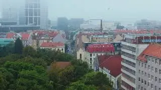 Aerial views highlight Brno, Czech Republic, showcasing vibrant red rooftops and lush greenery, with