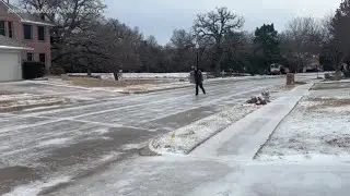 Man skates down street in north Texas as ice storms hit
