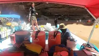 Unloading the boat at Poncho's Kitchen Mile 137