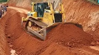 Extreme bulldozer earthmoving on MOUNTAIN SLOPE RUGGED TERRAIN ROAD ...