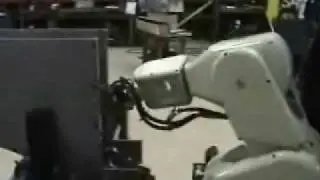 Robot loading centerless grinder