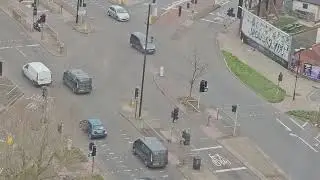 UK England's A Police Car & A Motorcycle on Full Gear Heading Towards Church Rd. Trucks Vans Cars