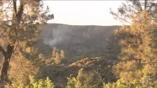 Headline: Powerhouse fire 60% contained; residents go home