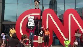 Protesters Graffiti CNN Sign During George Floyd Rally