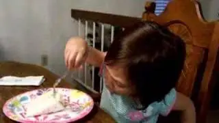 Luna eating a piece of Birthday Cake