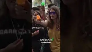Mass tourism protesters in Barcelona spray water at tourists #shorts