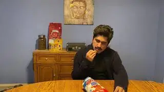 Eating Hot Wing flavored chips
