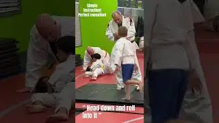 Judo black belt instructor throw new student with his belt