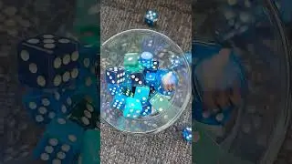 ASMR blue dice top view filling glass clinking