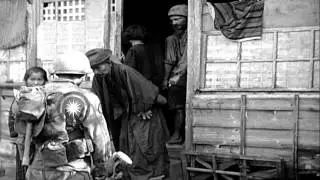 United States 7th Division infantrymen bring Japanese civilians out of the houses...HD Stock Footage