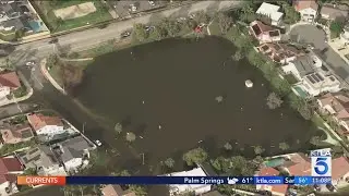 Torrential rains flood streets of Huntington Beach neighborhood