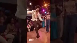 1980 Soul Train&ndash;style dancers strut and spin down a narrow dance runway i