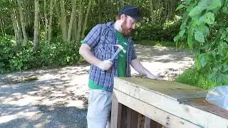 Rowan Lustig making a bear proof garbage bin