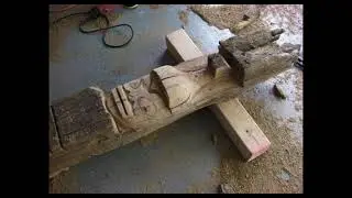 Totem pole carving from railroad tie wood