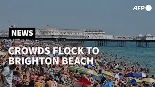 Crowds flock to Brighton Beach as temperatures rise up | AFP
