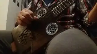 Miku cigar box bass ukulele with rubber strings