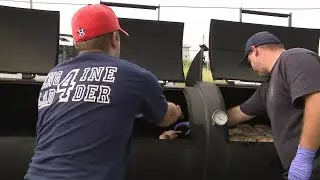Firefighters make BBQ for flood victims