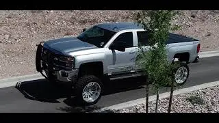 FELIX'S 2015 CHEVROLET SILVERADO 2500 HD WITH A 12 INCH FTS LIFT ON 24X12 AMERICAN FORCE WHEELS
