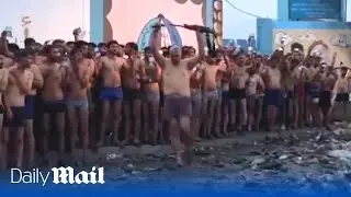 Dozens of alleged Hamas fighters lay down their weapons and surrender to the IDF in Gaza