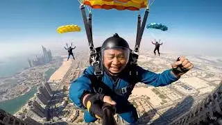 An 80-story skyscraper in Dubai, performing a breathtaking base jump. Multiple people are also jump.