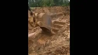 Skilled excavator operator making stairs