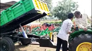 John Deere tractor 3036en model with trolley attached