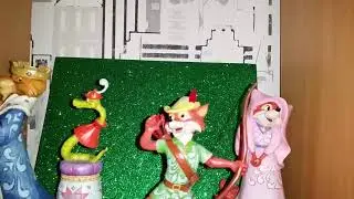 Jim Shore Disney Robin Hood figures on my book shelf