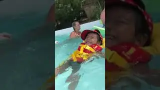 Itzy learning to swim with a swimming vest!