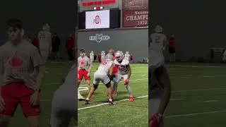 Eddrick Houston receives instruction from Ohio State defensive line coach Larry Johnson