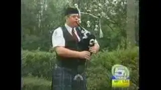 Michael Whinery. The Professional Bagpiper Infront of a Bigger Audience