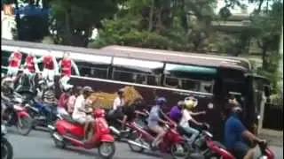 Arsenal fans in Vietnam chasing after Arsenal bus #AsiaTour2013