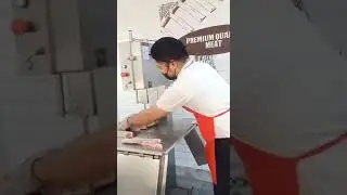 Using Bonesaw cutting the pork belly into cut perslice