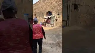 The old lady s life in the cave abode taking advantage of the fine weather pushed a cart t