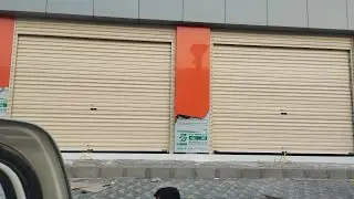 Installation of a new garage door with a handmade decorative curtain#0541421378 