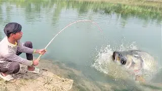 Fishing Video || Traditional village boy fishing in pond with hook in heavy rain || Hook fishing