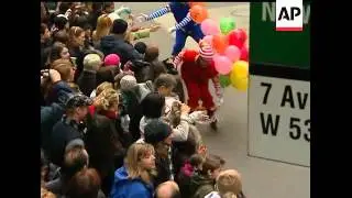 Giant balloons, floats and marching bands bring smiles to thousands of revelers eager to catch a gli