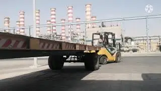 How to tow a trolley attached to the back of a forklift.