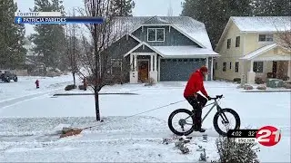 Bend man clears neighborhood sidewalks on his homemade bicycle snow plow