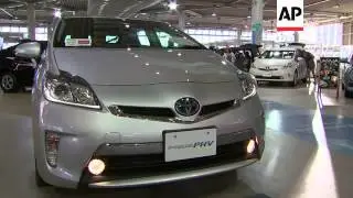 Toyota said Wednesday it is recalling 1.9 million hybrid Prius cars globally for a software glitch t