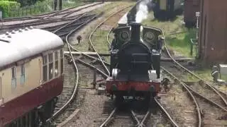 H-class tank engine takes on water and sets off from Sheffield Park