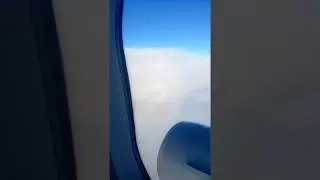 Airplane shadow inside a full circle rainbow on top of the clouds!