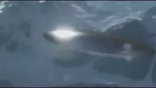 Military Helicopter Filmed this Disc-Shaped Silver UFO in Sakhalin Island