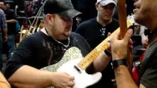 Johnny Hiland checking out a Guitar Mill Tele